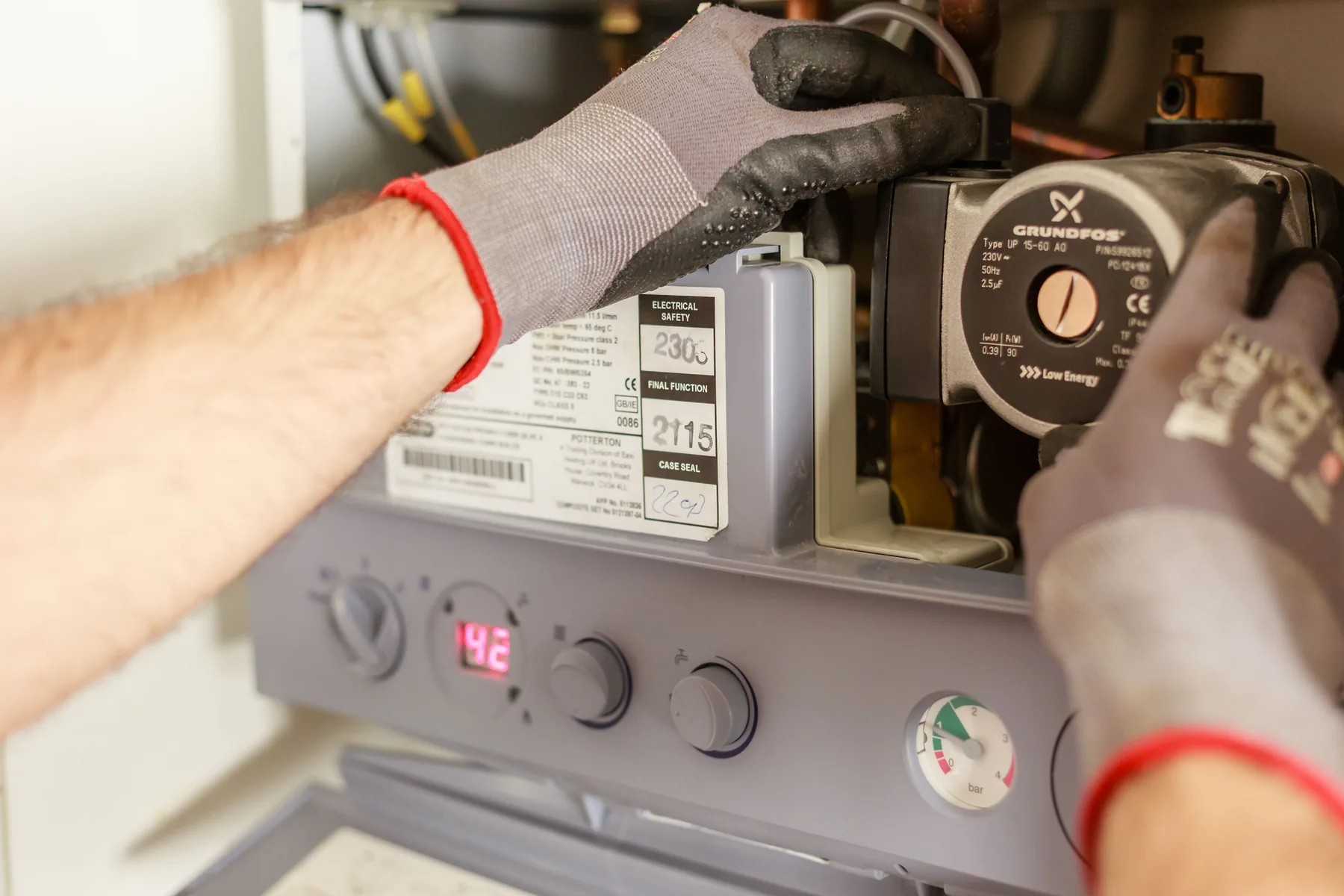Heating engineer servicing a boiler in Southport